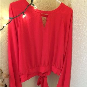 Reddish orange open back ties in back long sleeve